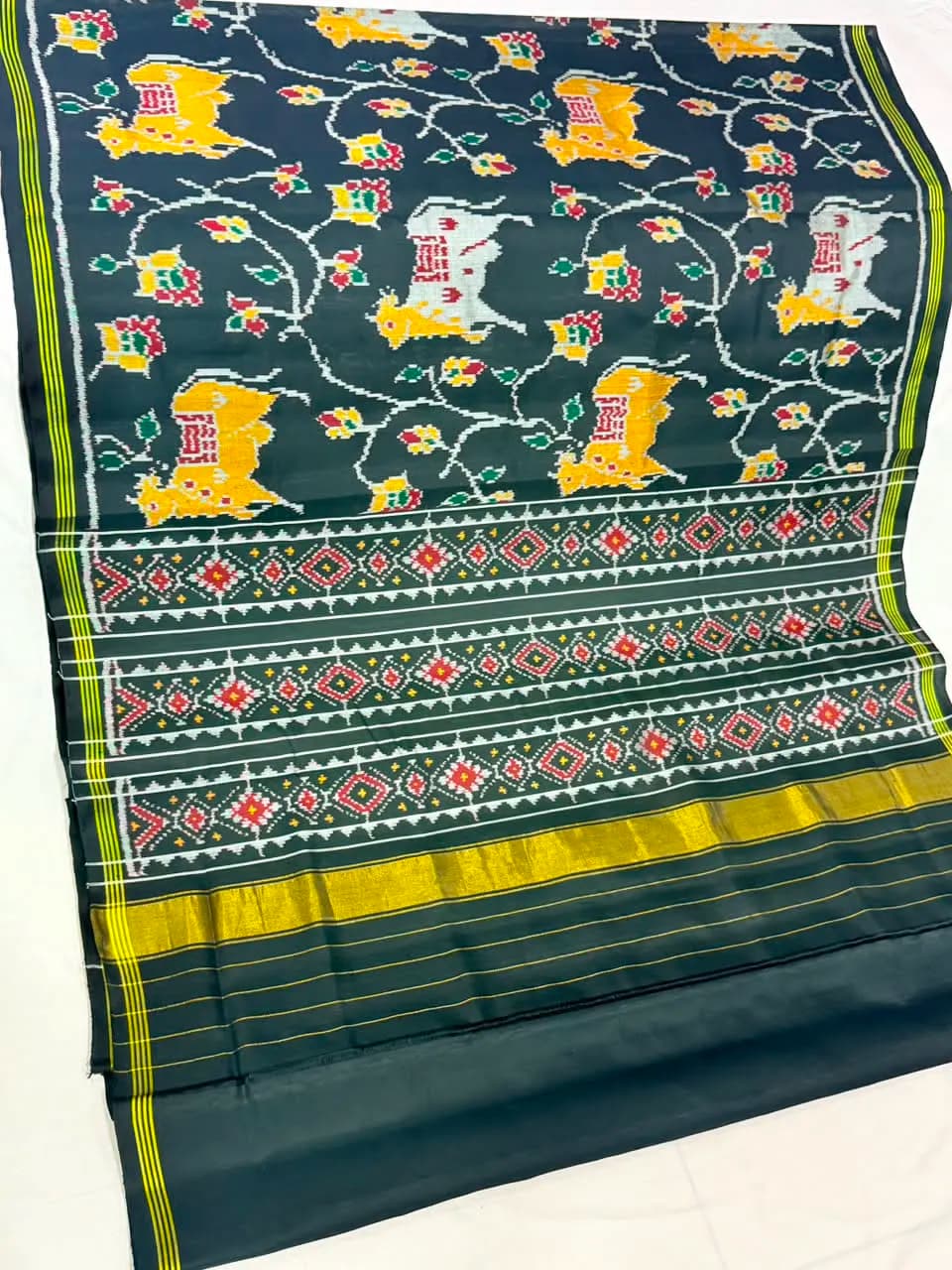 White Yellow Cow Flower Vine Dark Green Patola Saree